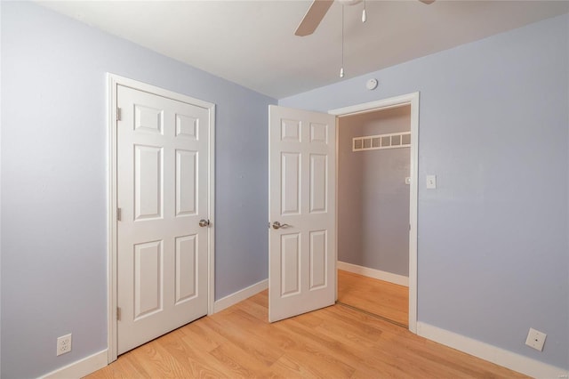 unfurnished bedroom with light wood-type flooring, baseboards, visible vents, and ceiling fan