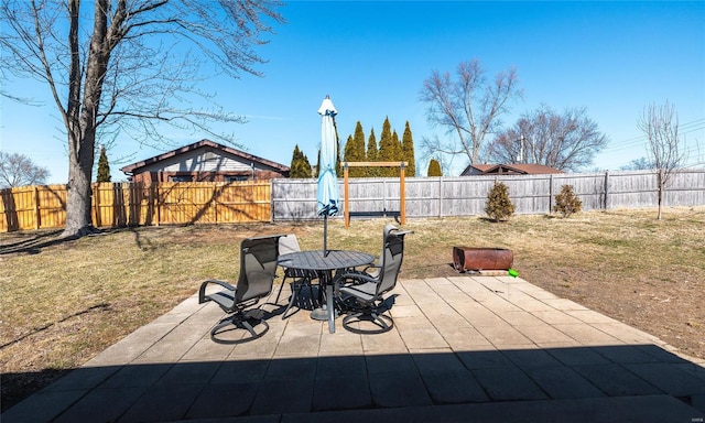 view of patio featuring outdoor dining space and a fenced backyard