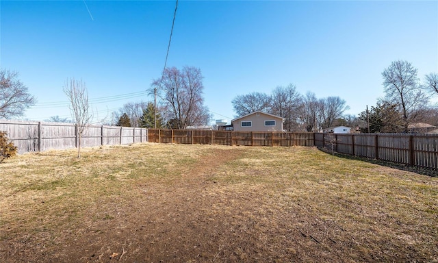 view of yard featuring a fenced backyard