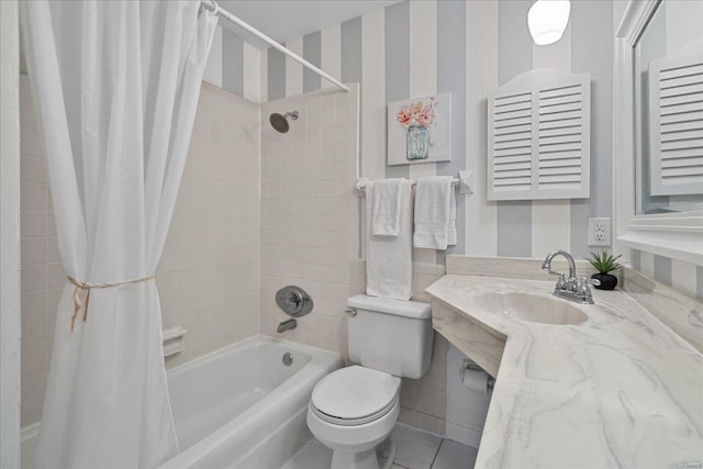 bathroom featuring wallpapered walls, toilet, shower / bath combo with shower curtain, vanity, and tile patterned floors