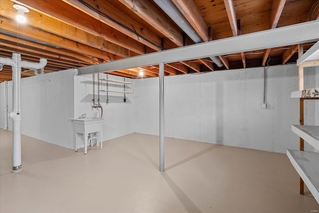 unfinished basement featuring a sink