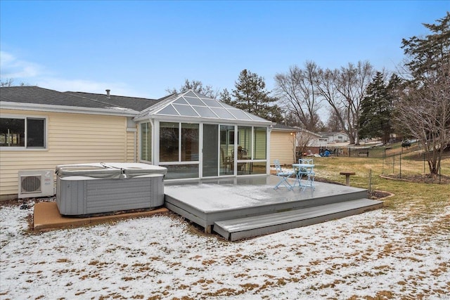 back of property with a deck, fence, a hot tub, and central AC unit