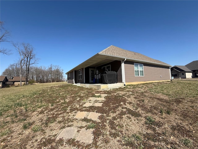 view of property exterior with a yard