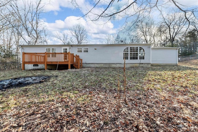 back of property featuring fence and a wooden deck