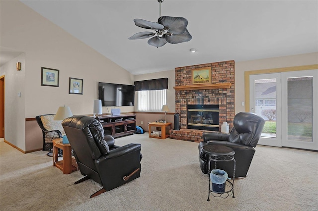 living area featuring high vaulted ceiling, carpet floors, a ceiling fan, baseboards, and a brick fireplace