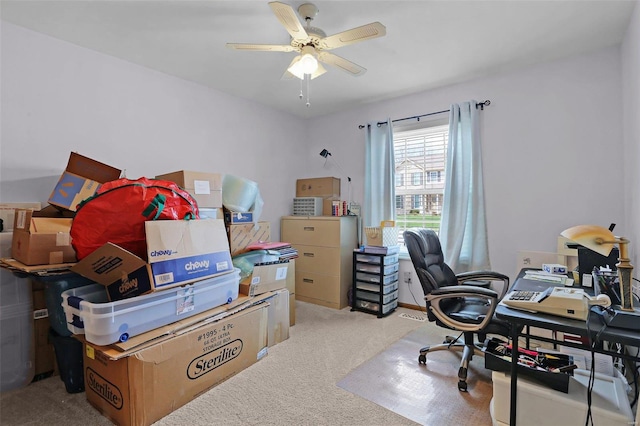 office featuring a ceiling fan and light colored carpet