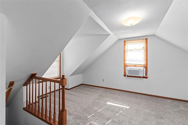 bonus room featuring lofted ceiling, carpet floors, cooling unit, and baseboards