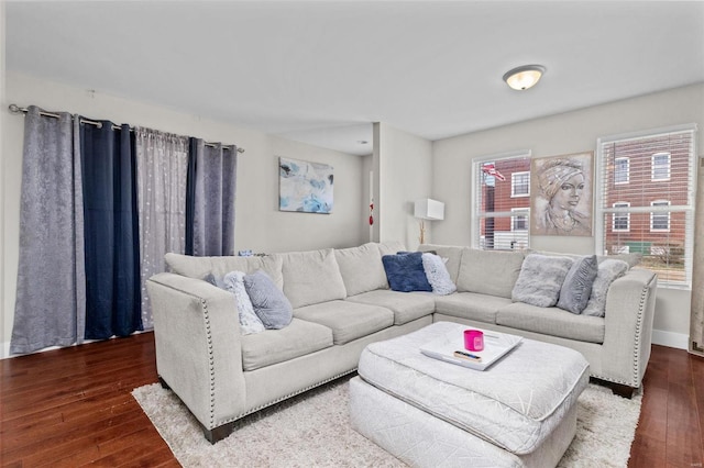 living area with baseboards and hardwood / wood-style floors