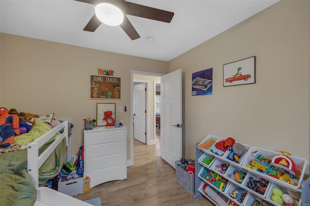 bedroom featuring light wood-style floors and ceiling fan