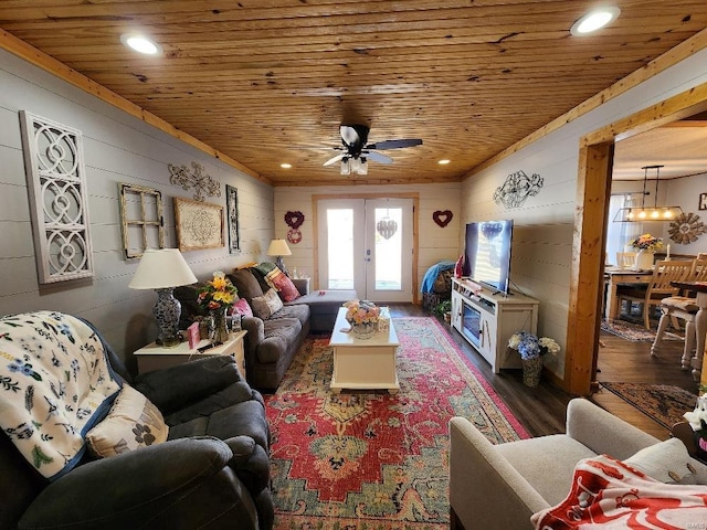 living room with wooden ceiling, recessed lighting, wood finished floors, and french doors