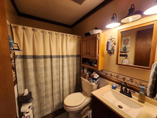 bathroom with ornamental molding, vanity, toilet, and curtained shower