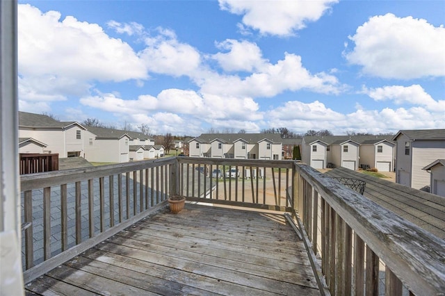 wooden deck with a residential view