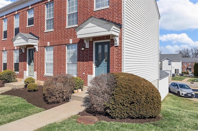 view of front of house with brick siding