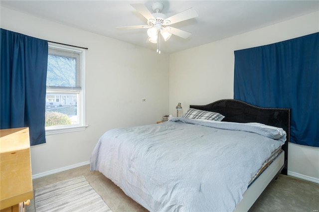 bedroom featuring carpet, ceiling fan, and baseboards