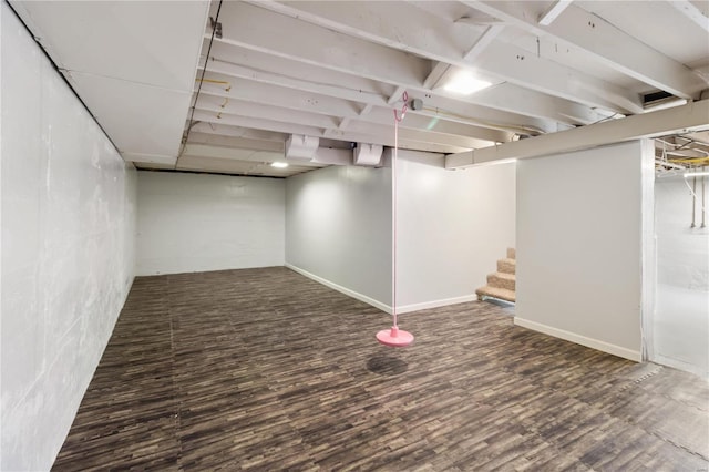 finished basement featuring wood finished floors and stairs