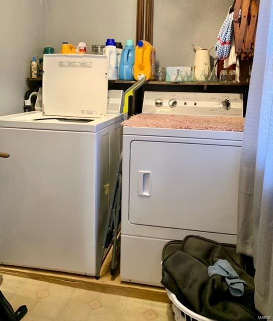 laundry room featuring laundry area and washer and clothes dryer