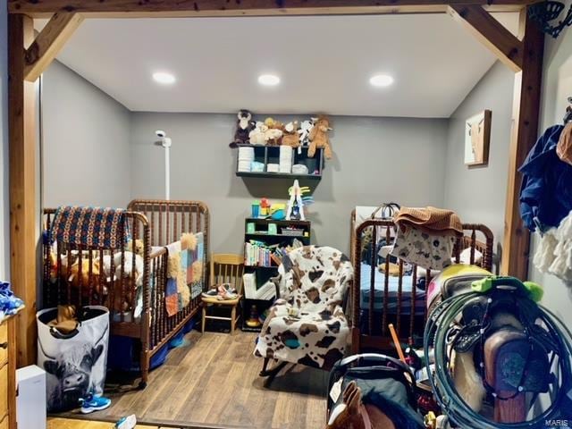 bedroom featuring wood finished floors and recessed lighting