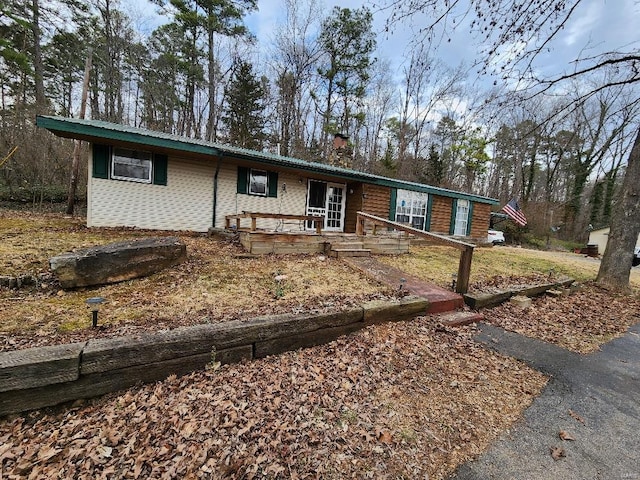 single story home featuring a chimney