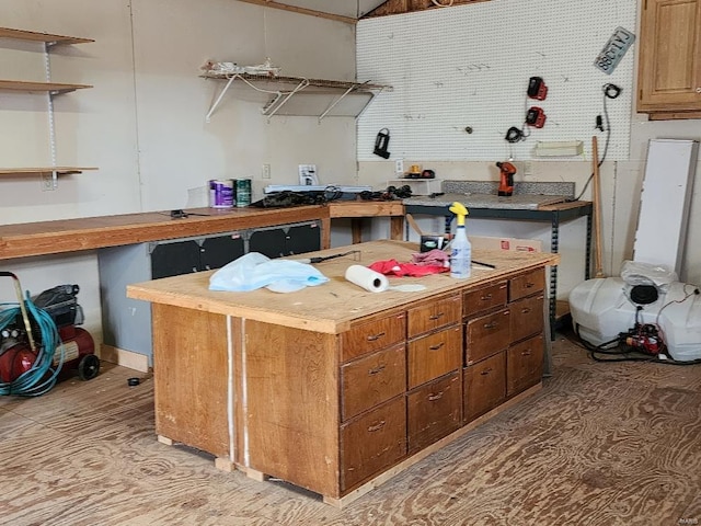 kitchen featuring brown cabinetry, butcher block countertops, and open shelves