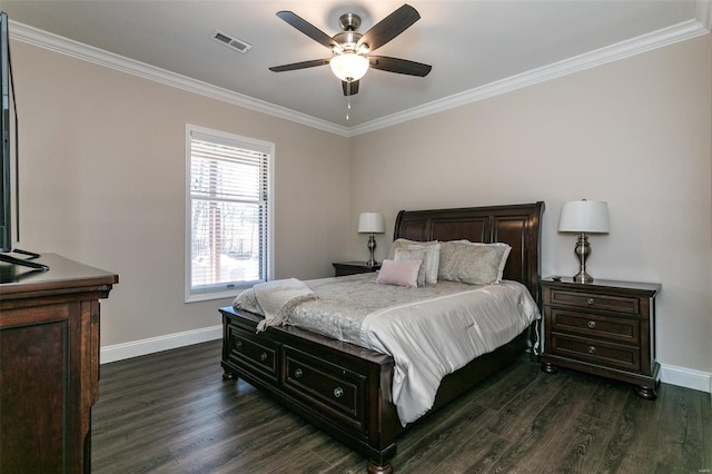 bedroom featuring ornamental molding, dark wood-type flooring, visible vents, and baseboards