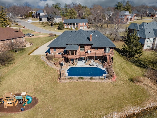 view of pool featuring a patio area, a residential view, and a deck