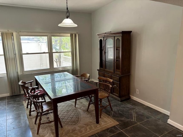 dining room with baseboards