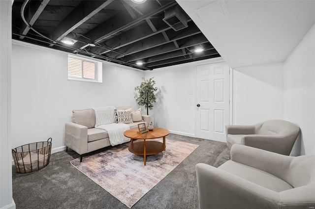 carpeted living room featuring baseboards