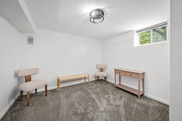sitting room featuring baseboards, visible vents, and carpet
