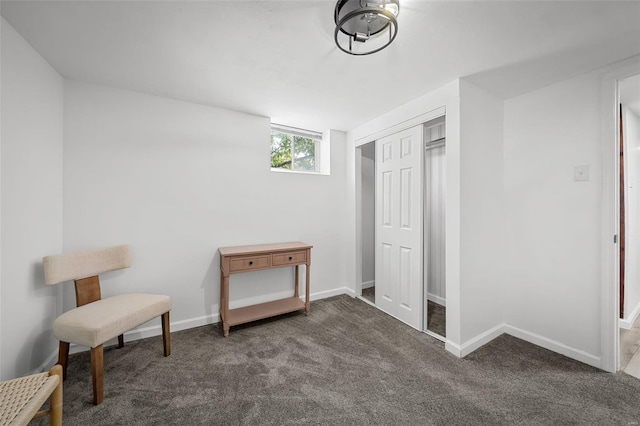 sitting room with carpet floors and baseboards