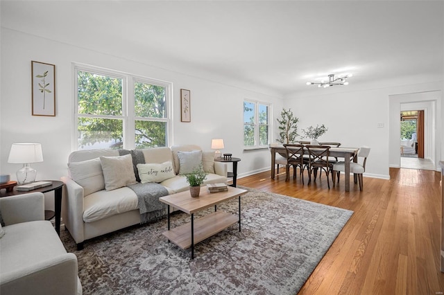 living room featuring baseboards and wood finished floors