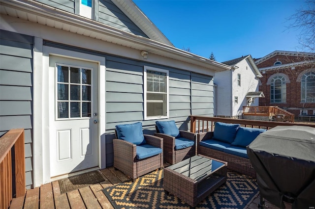 wooden deck with an outdoor hangout area