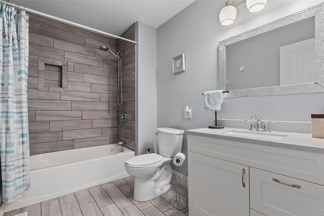 bathroom featuring toilet, wood tiled floor, shower / bath combination with curtain, and vanity