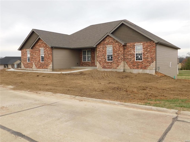 view of front of home with brick siding