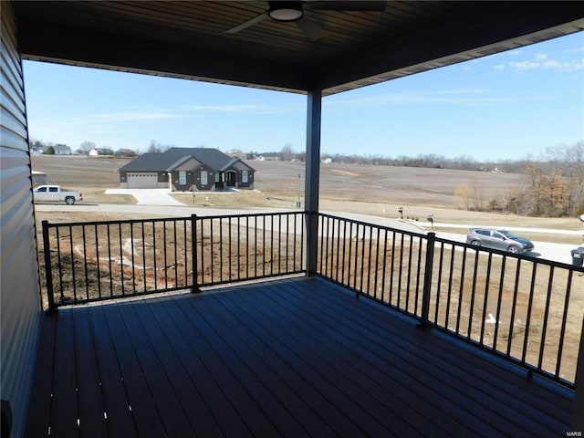 wooden terrace featuring ceiling fan