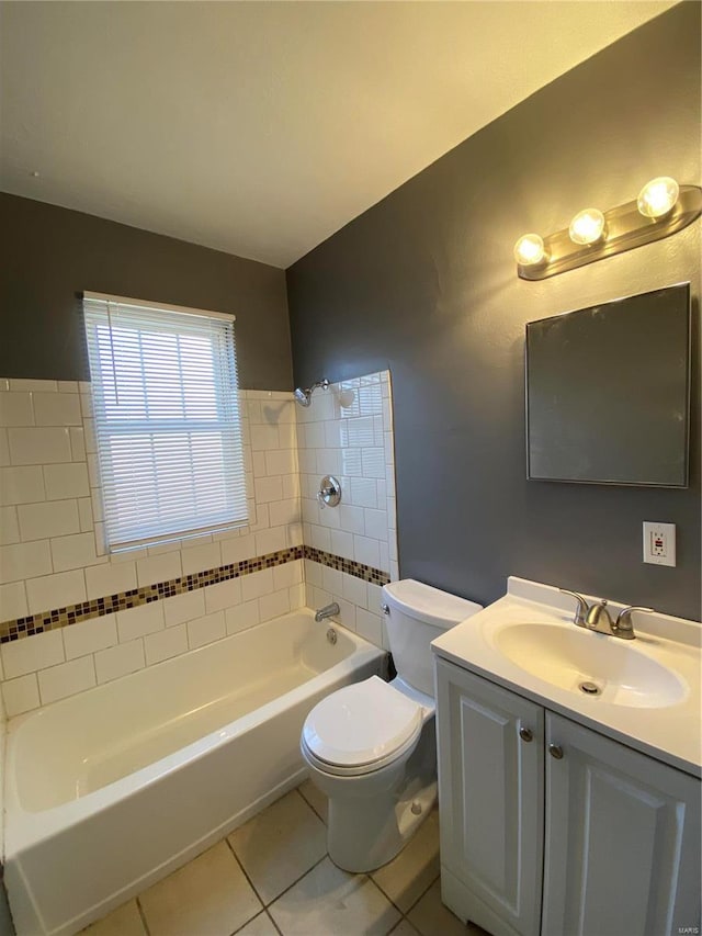 bathroom featuring shower / bathing tub combination, vanity, toilet, and tile patterned floors