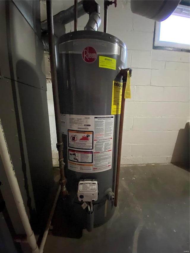 utility room with water heater