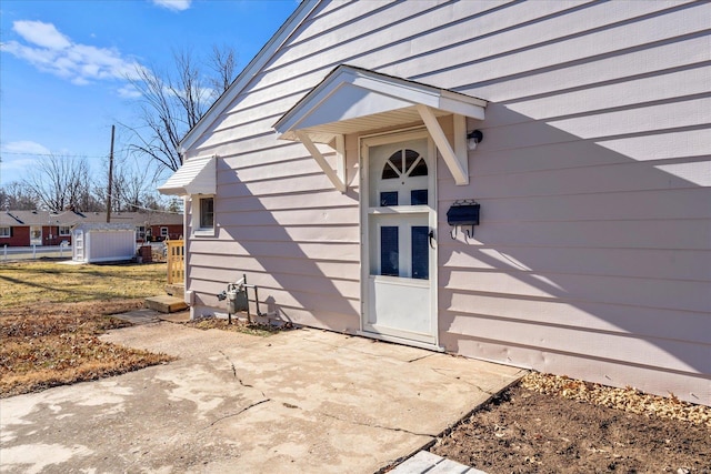 property entrance with a patio