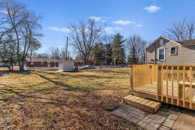 view of yard with fence and a deck