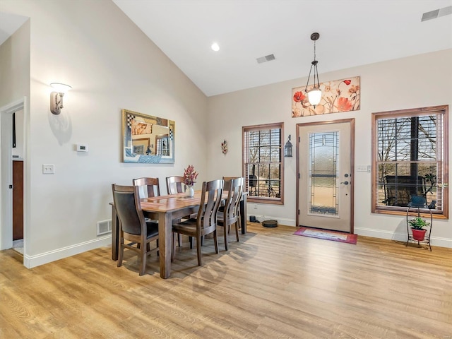 dining room with visible vents and light wood finished floors