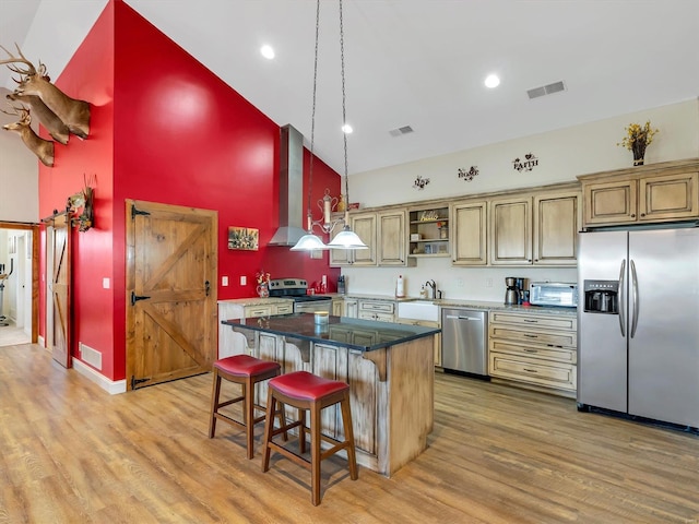 kitchen featuring visible vents, wall chimney exhaust hood, appliances with stainless steel finishes, light wood-type flooring, and open shelves