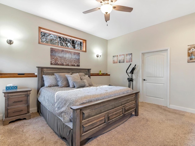 bedroom featuring light carpet, ceiling fan, and baseboards