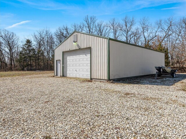 detached garage featuring driveway