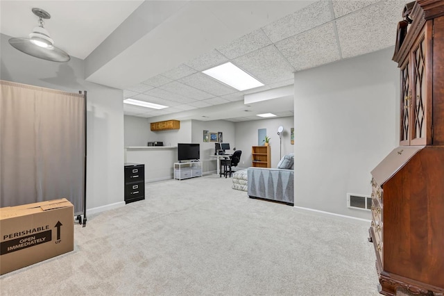 office with a drop ceiling, carpet, visible vents, and baseboards