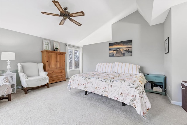 carpeted bedroom featuring a ceiling fan, lofted ceiling, and baseboards