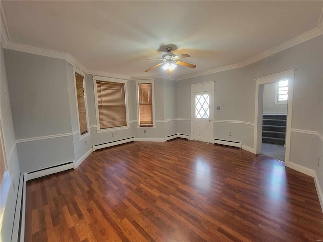 spare room featuring a baseboard radiator, stairs, a baseboard heating unit, and wood finished floors