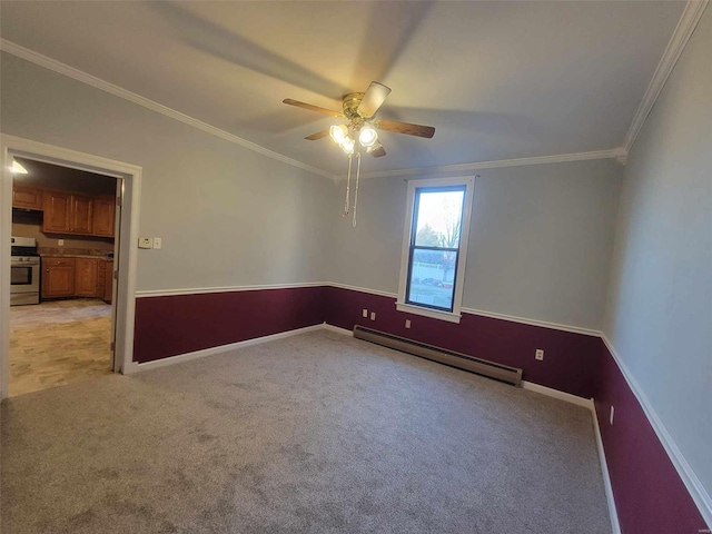 empty room featuring light colored carpet, a baseboard heating unit, ornamental molding, ceiling fan, and baseboards