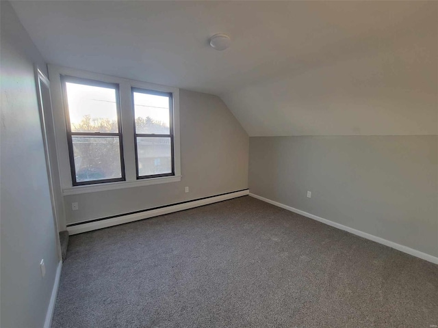 bonus room featuring lofted ceiling, a baseboard radiator, baseboards, and carpet flooring