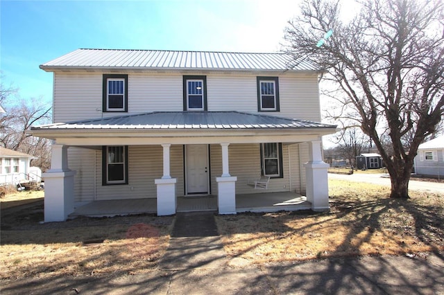 view of front facade with metal roof and a porch