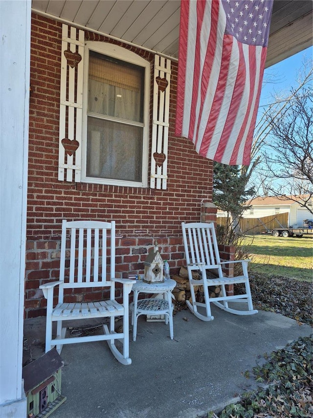 view of patio / terrace featuring fence