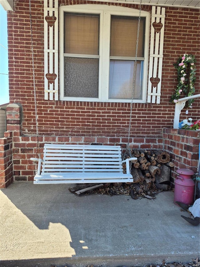 exterior details featuring brick siding